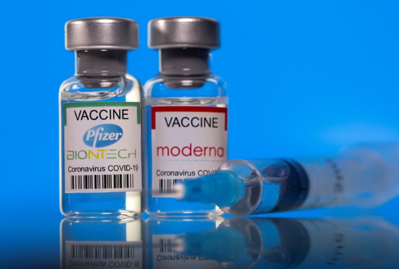 FILE PHOTO: Picture illustration of vials with Pfizer-BioNTech and Moderna