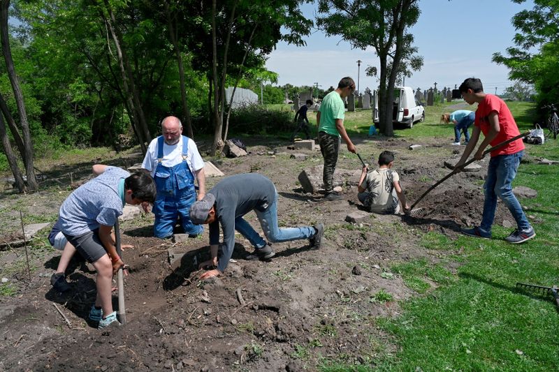 Slovak Roma teens help to restore forgotten Jewish cemetery, in