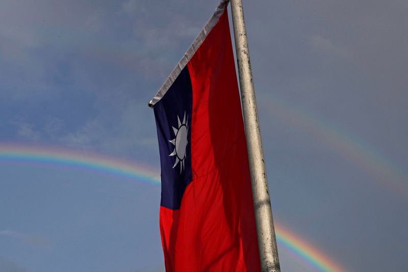 A double rainbow is seen behind Taiwanese flag during the