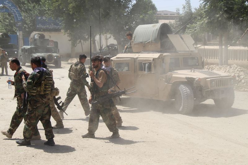 Afghan Commando forces are seen at the site of a