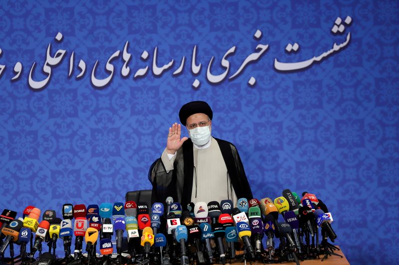 Iran’s President-elect Ebrahim Raisi gestures at a news conference in