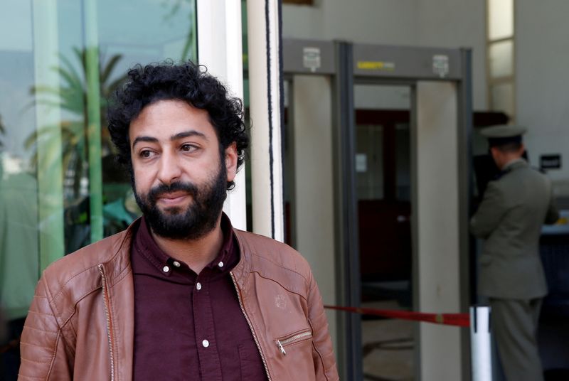 FILE PHOTO: Journalist and activist Omar Radi waits outside court