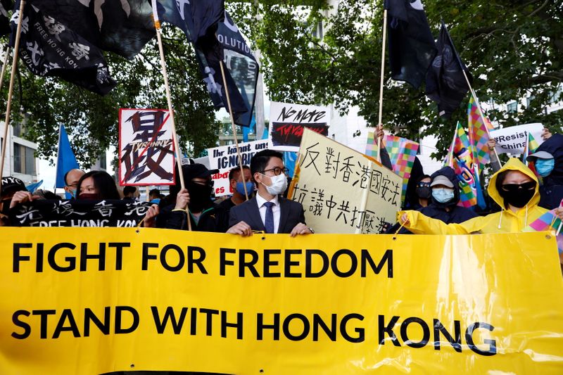 FILE PHOTO: Hong Kong exile pro-democracy activist Nathan Law holds