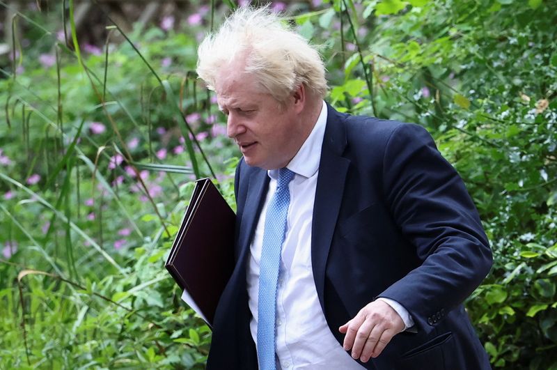 Britain’s Prime Minister Boris Johnson walks in Downing Street, in