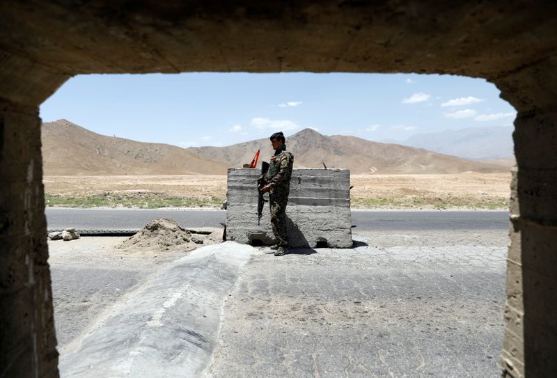 Afghan National Army soldier stands guard at a check post