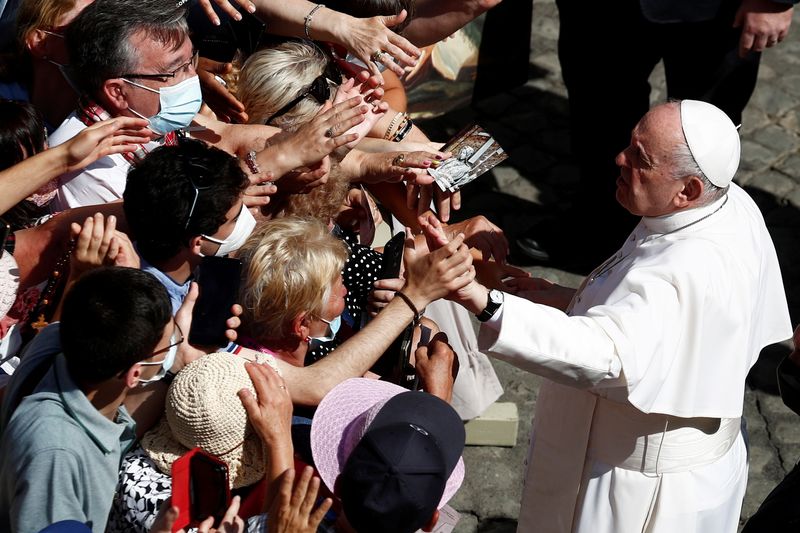 FILE PHOTO: Pope Francis greets people after the weekly general