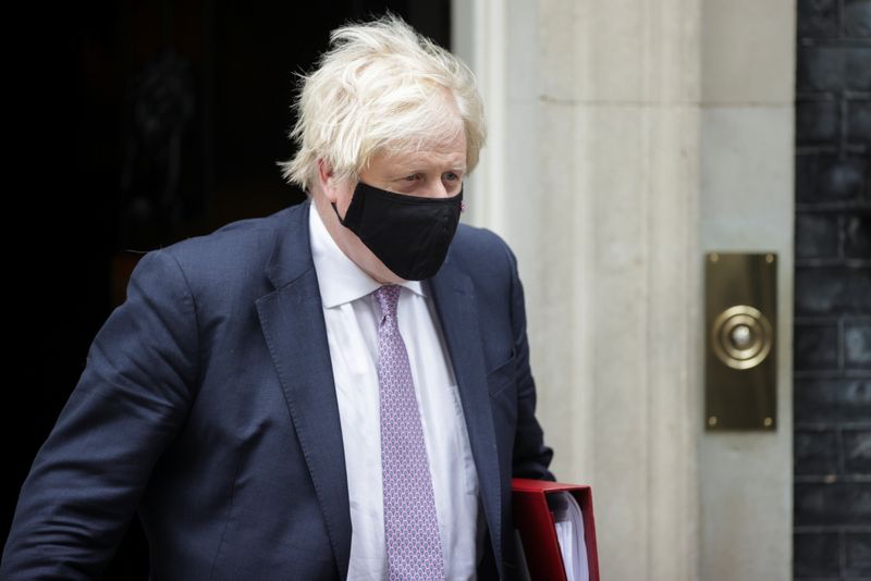 Britain’s Prime Minister Boris Johnson walks outside Downing Street in