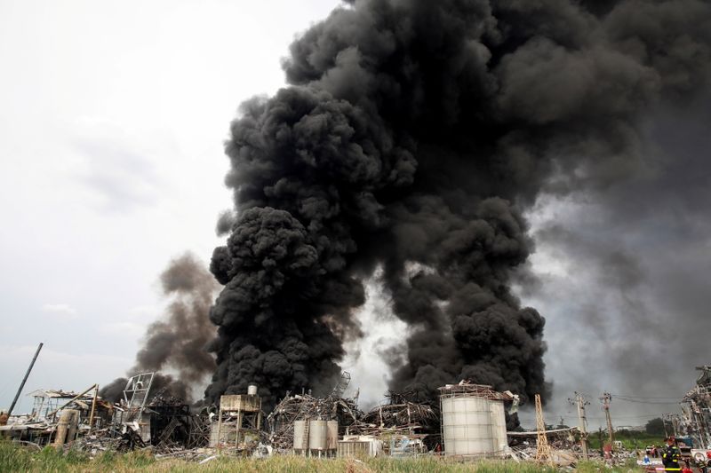 FILE PHOTO: An explosion and fire destroy a factory in