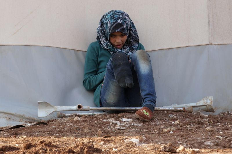 FILE PHOTO: An internally displaced Syrian girl with an amputated