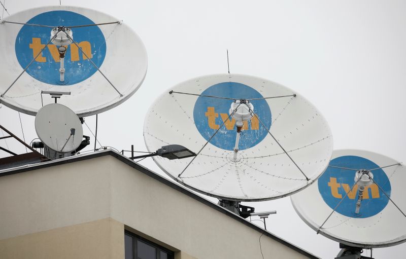 Private television TVN logo is seen on satellite antennas at