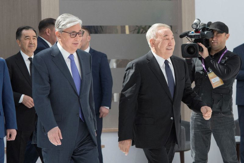 FILE PHOTO: Kassym-Jomart Tokayev and Nursultan Nazarbayev attend the Astana