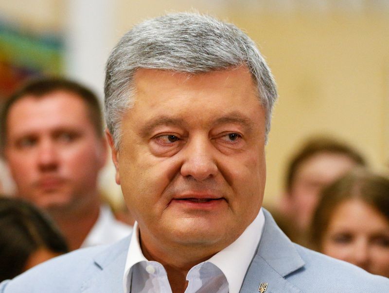 Ukraine’s former President Poroshenko speaks at a polling station during