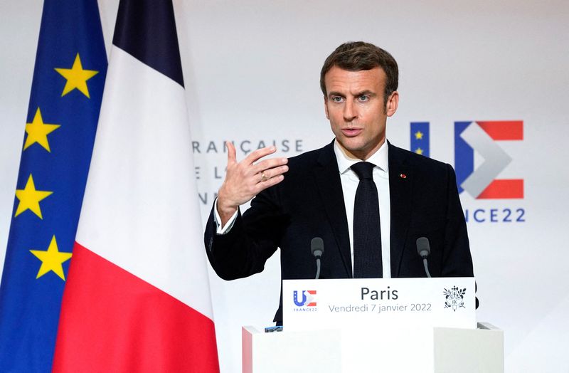 French President Emmanuel Macron speaks as he participates in a