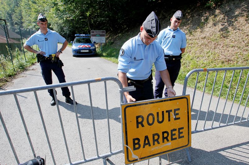 FILE PHOTO: French gendarmes block access to a road to