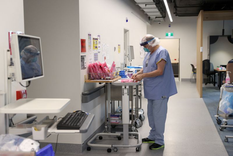 A nurse prepares to test patients for the coronavirus disease