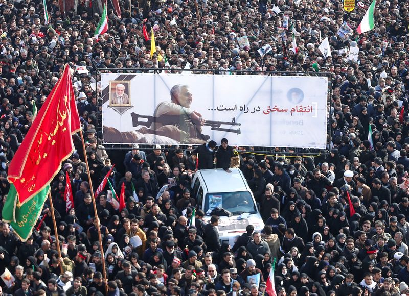 FILE PHOTO: Iranian people attend a funeral procession for Iranian
