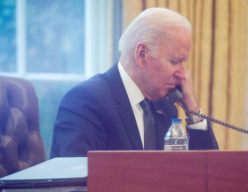FILE PHOTO: U.S. President Joe Biden speaks by phone with