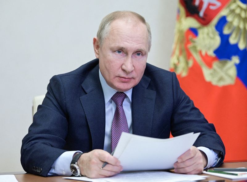 FILE PHOTO: Russian President Putin chairs a meeting of the