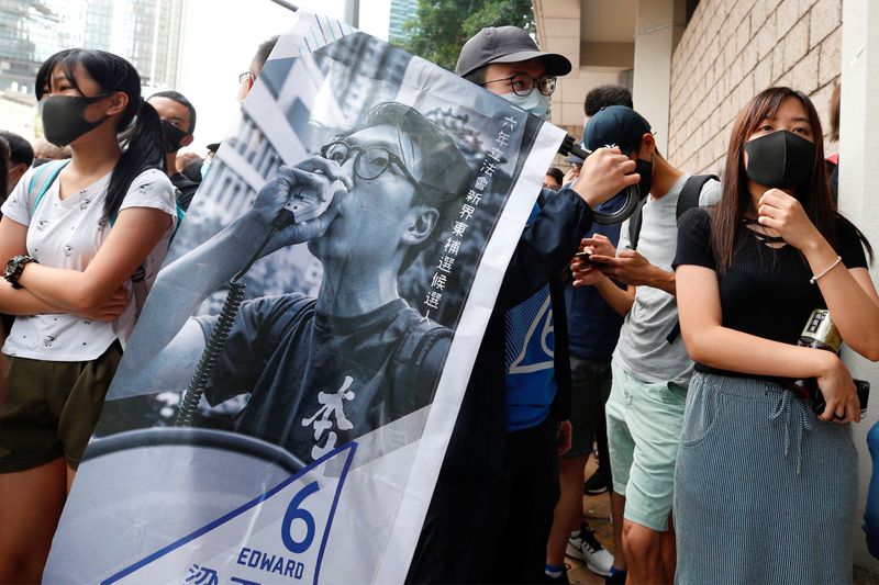 Supporters of jailed activist Leung, gather outside the High Court