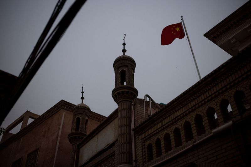 FILE PHOTO: The Wider Image: In China’s new Xinjiang: patriotic