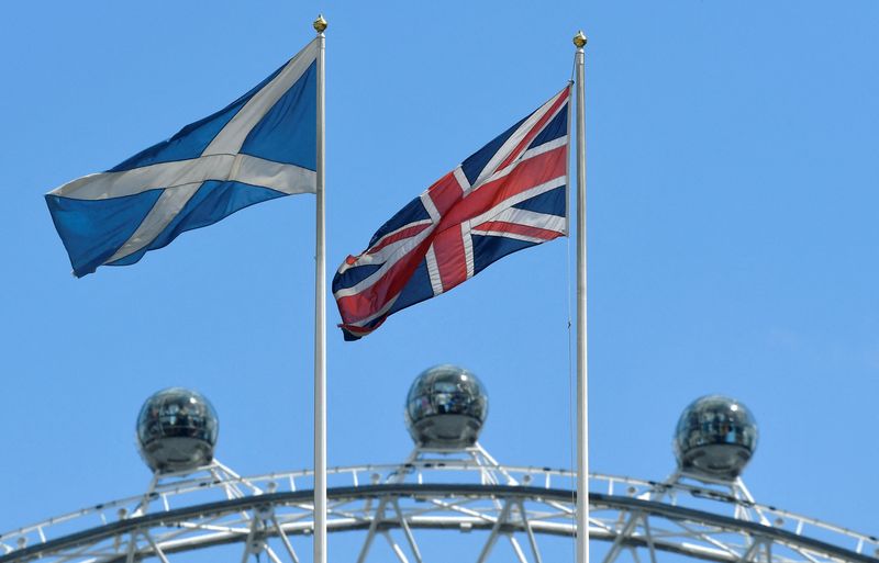 FILE PHOTO: The Scottish Saltire flag flies next to the