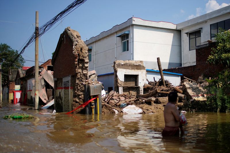 FILE PHOTO: Flooded houses are seen at a village following