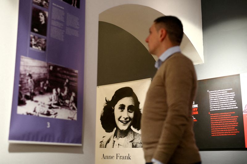 FILE PHOTO: A man looks at an exhibition about Anne