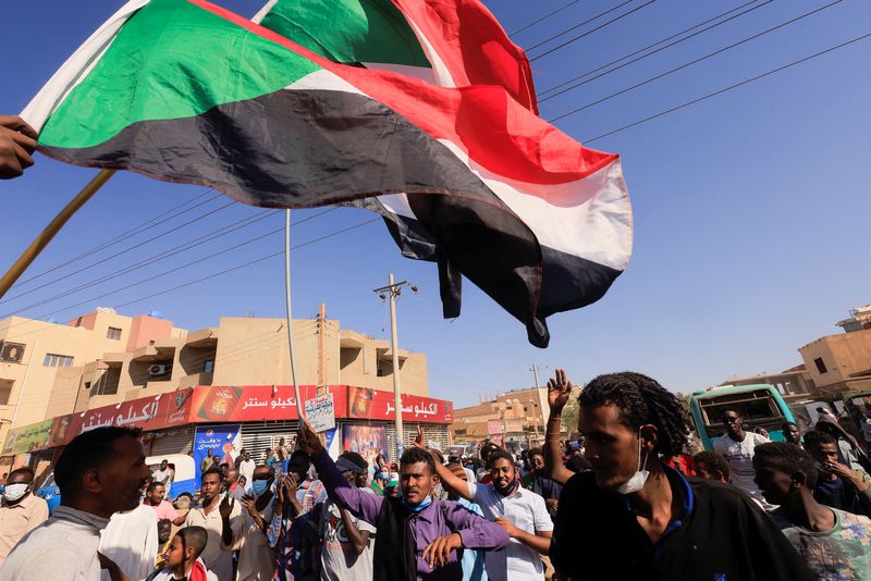 People attend a protest rally in Khartoum