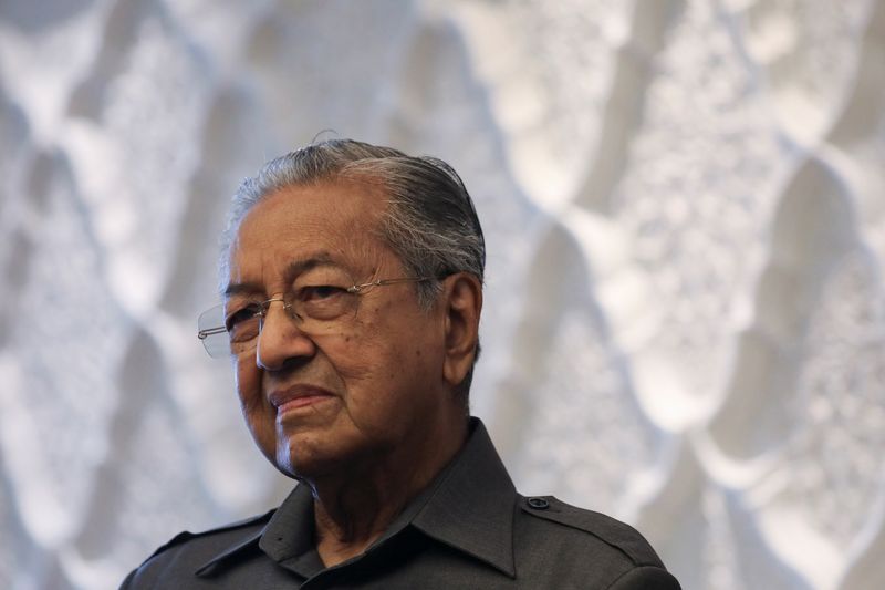 Malaysia’s former Prime Minister Mahathir Mohamad reacts during an interview