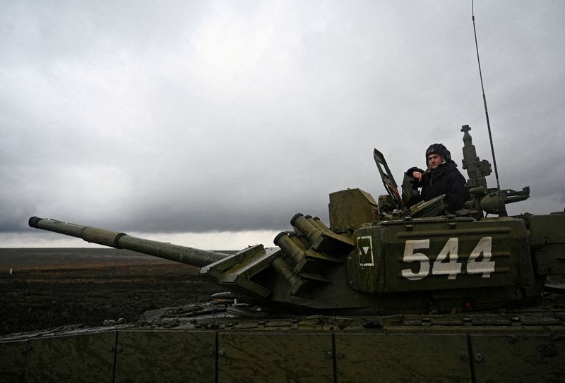 FILE PHOTO: A Russian service member is seen atop a