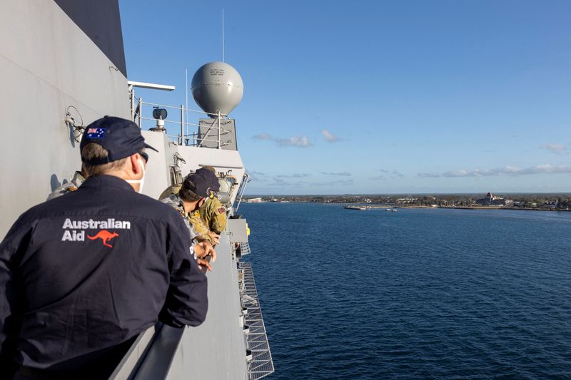 HMAS Adelaide carrying disaster relief sails into the port of