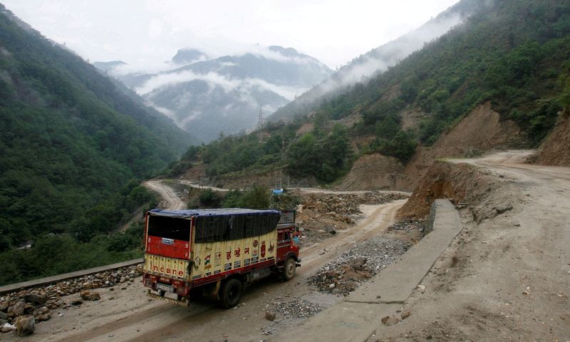 FILE PHOTO: A delivery truck drives along India’s Tezpur-Tawang highway