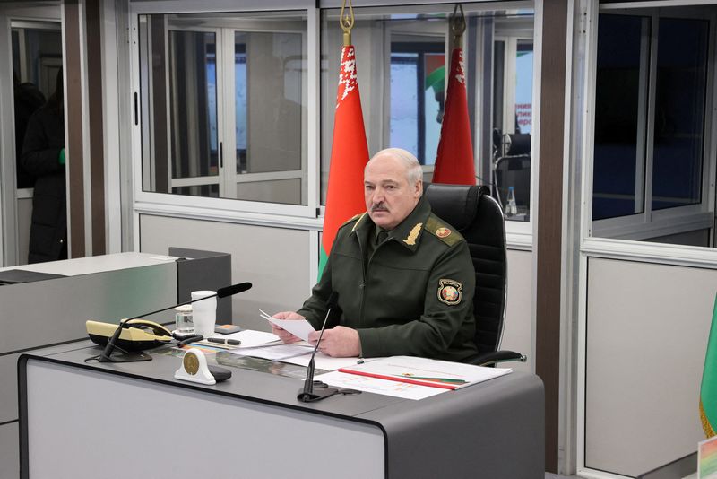 Belarusian President Alexander Lukashenko chairs a meeting after inspecting military