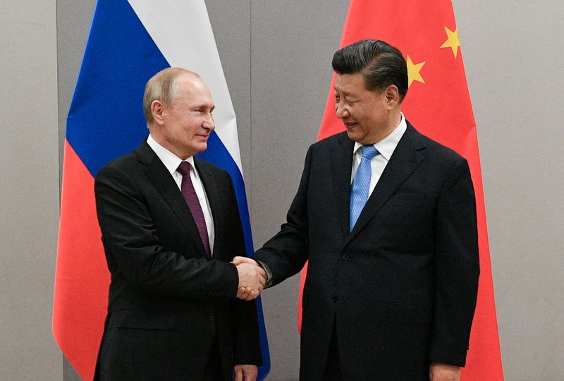 FILE PHOTO: Russian President Putin meets with Chinese President Xi