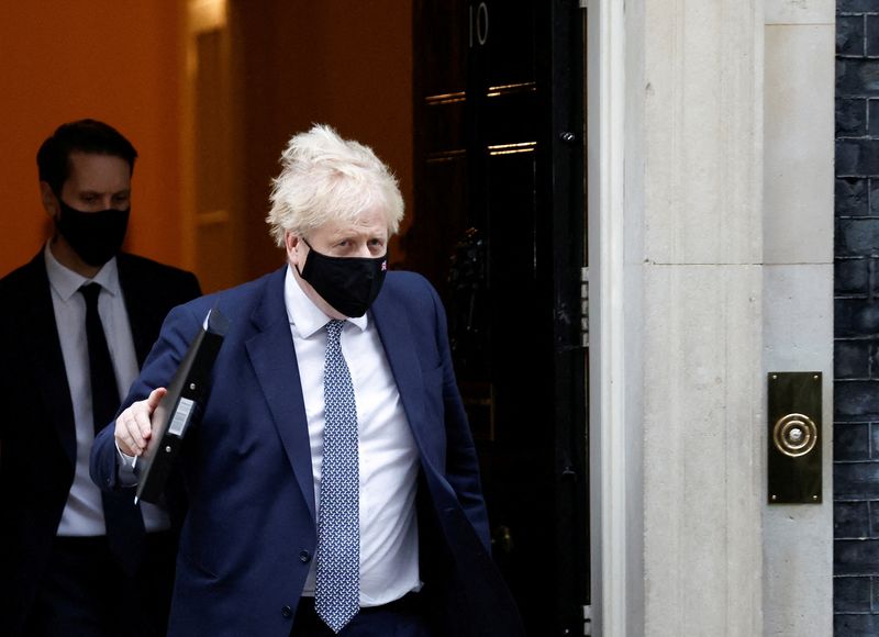 British Prime Minister Boris Johnson walks outside Downing Street in