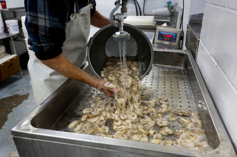FILE PHOTO: Peanut Shiver of Barber’s Seafood in Eastpoint, Florida,