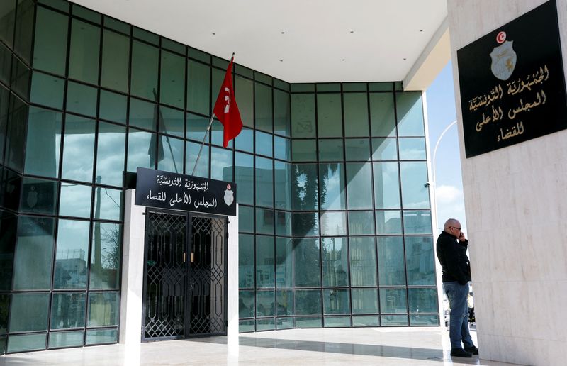 FILE PHOTO: Man stands outside the Supreme Judicial Council building