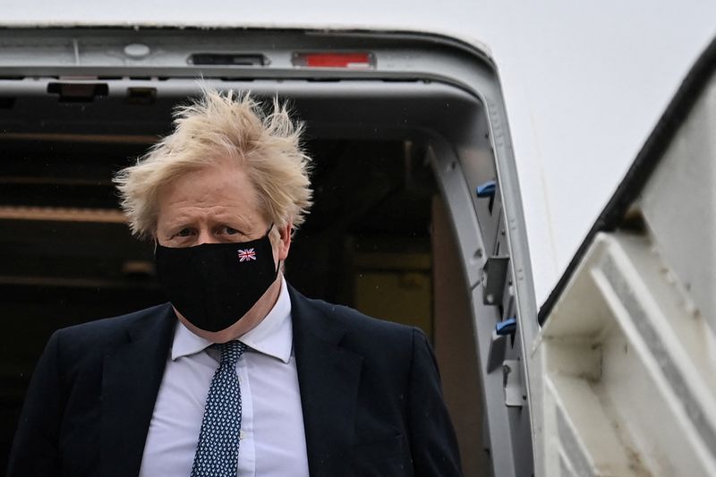 British Prime Minister Boris Johnson arrives at the airport, in
