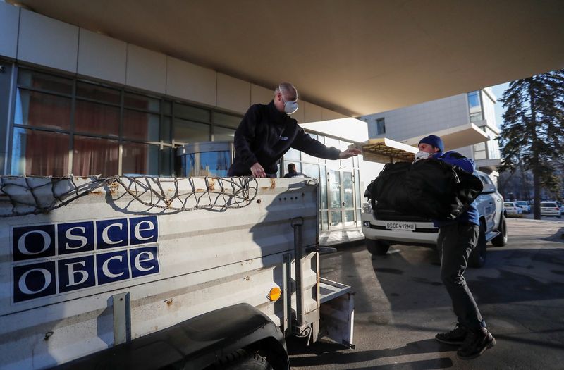OSCE members leave a hotel in Donetsk