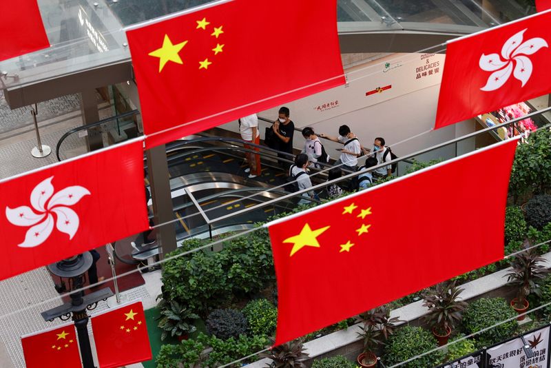 Chinese and Hong Kong flags are pictured outside a mall