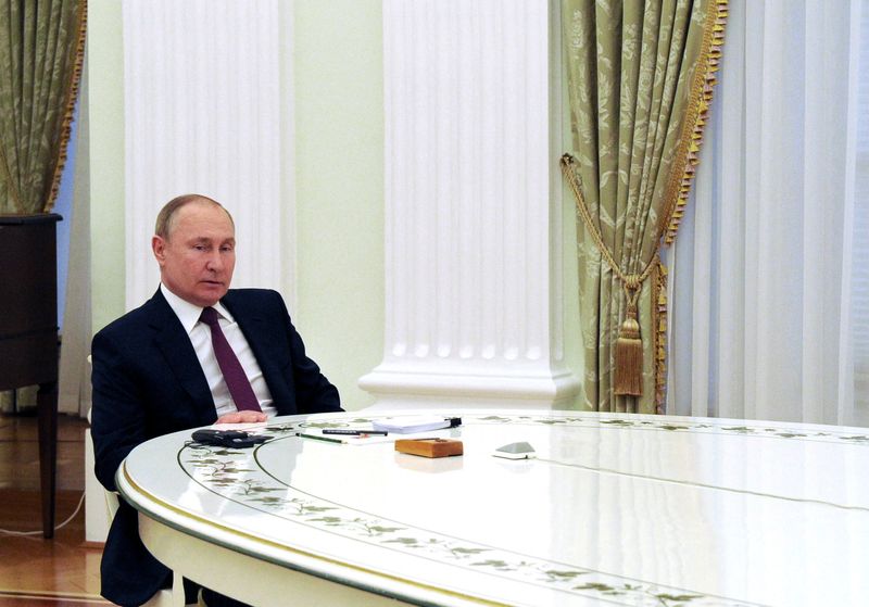 Russian President Vladimir Putin meets with German Chancellor Olaf Scholz