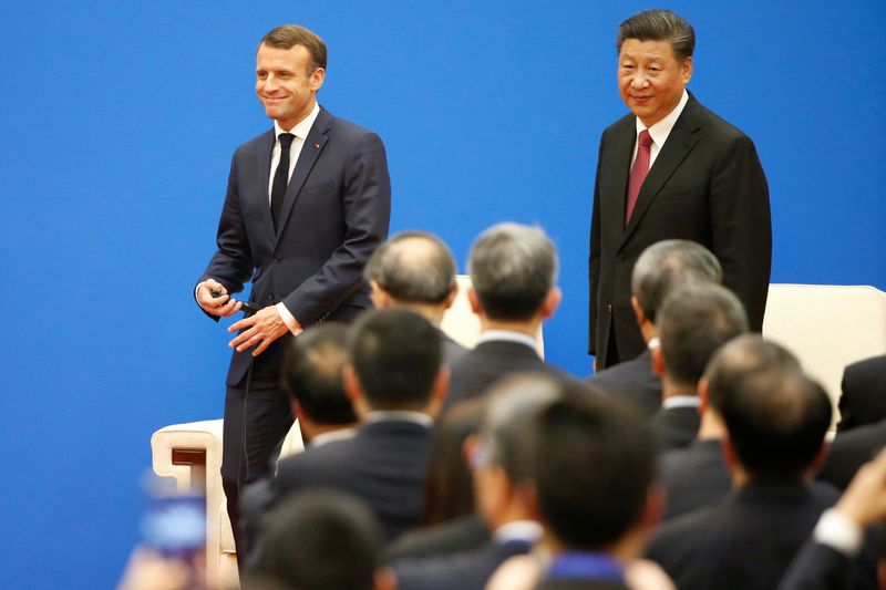 FILE PHOTO: French President Emmanuel Macron and Chinese President Xi