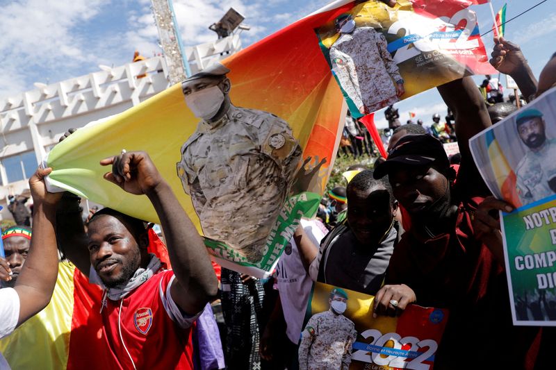 FILE PHOTO: Supporters participate in a demonstration called by Mali