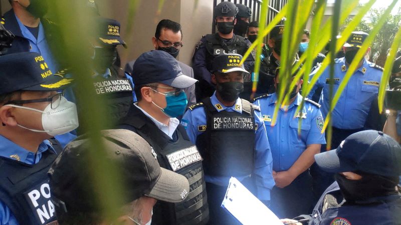 FILE PHOTO: Former Honduras President Hernandez leaves home escorted by