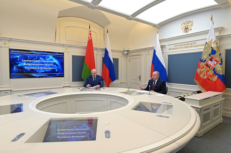 Russian President Vladimir Putin and Belarusian President Alexander Lukashenko observe