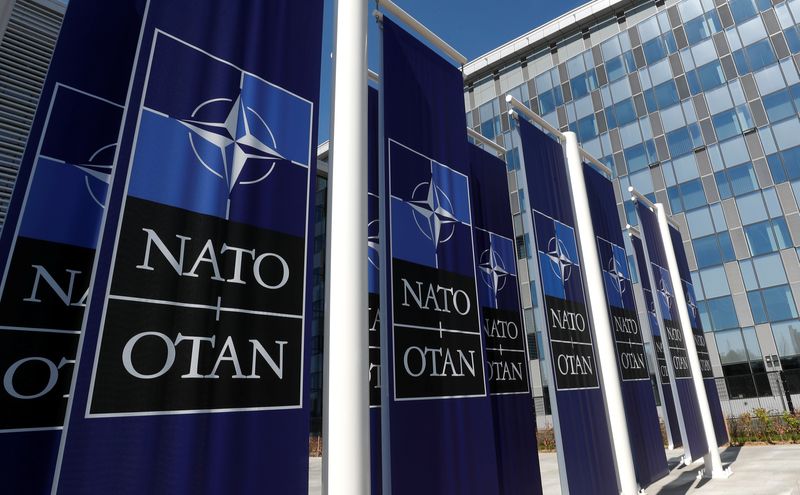 Banners displaying the NATO logo are placed at the entrance
