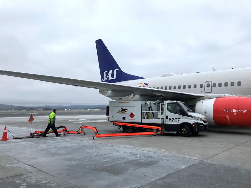FILE PHOTO: A Scandinavian Airlines (SAS) plane is refuelled at