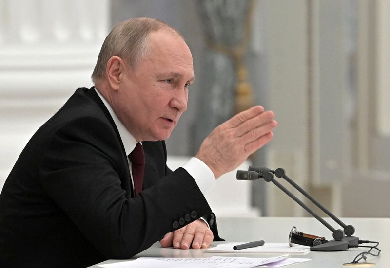 Russian President Putin chairs a meeting with members of the