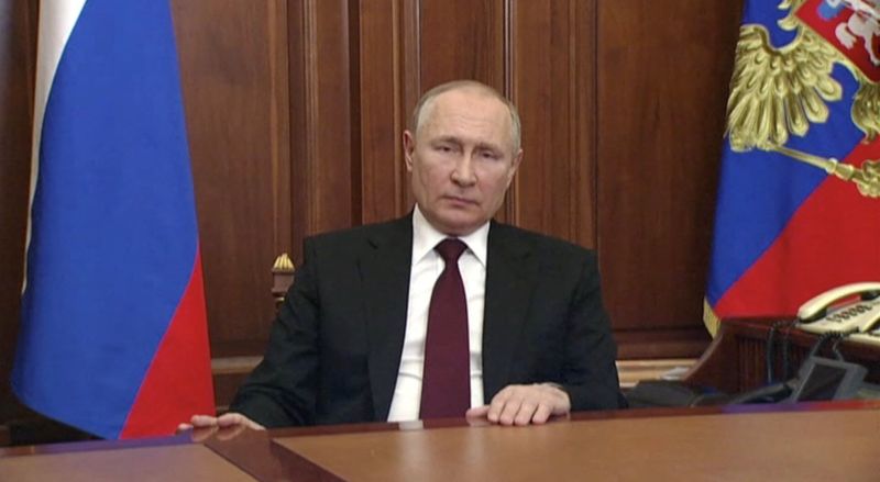 Russian President Vladimir Putin delivers a video address to the