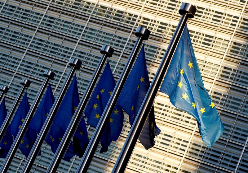 FILE PHOTO: EU flags are seen outside the EU Commission